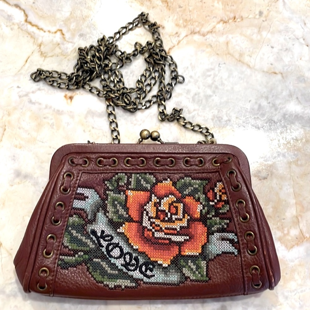 ISABELLA FIORE Brown leather and needlepoint bag with Love stitching on front.